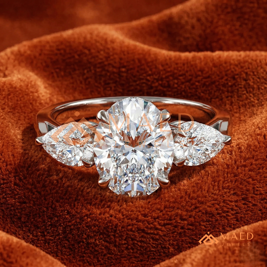 Classic Oval Cut Three-Stone Engagement Ring with Pear Side Stones in Silver, 14K Gold & Rose Gold