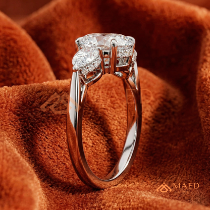 Classic Oval Cut Three-Stone Engagement Ring with Pear Side Stones in Silver, 14K Gold & Rose Gold