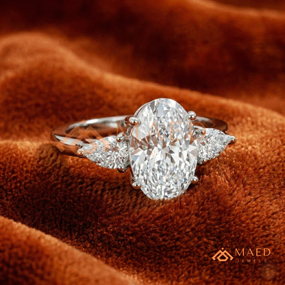Oval Cut Engagement Ring with Pear Side Stones in Silver, 14K Gold, & 14K Rose Gold