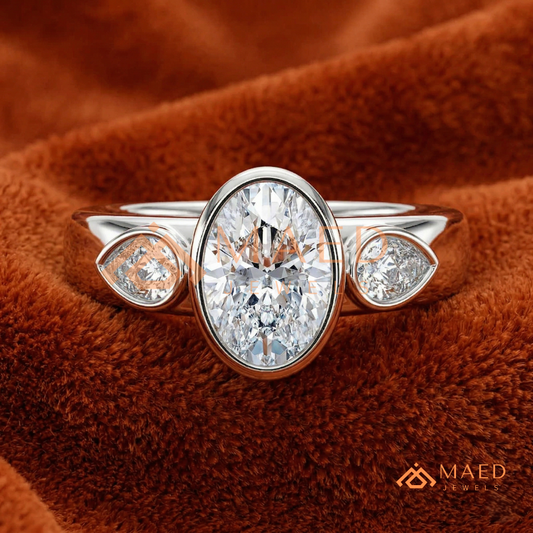 Bezel Set Oval Engagement Ring with Pear Side Stones in Silver, 14K Gold, & 14K Rose Gold