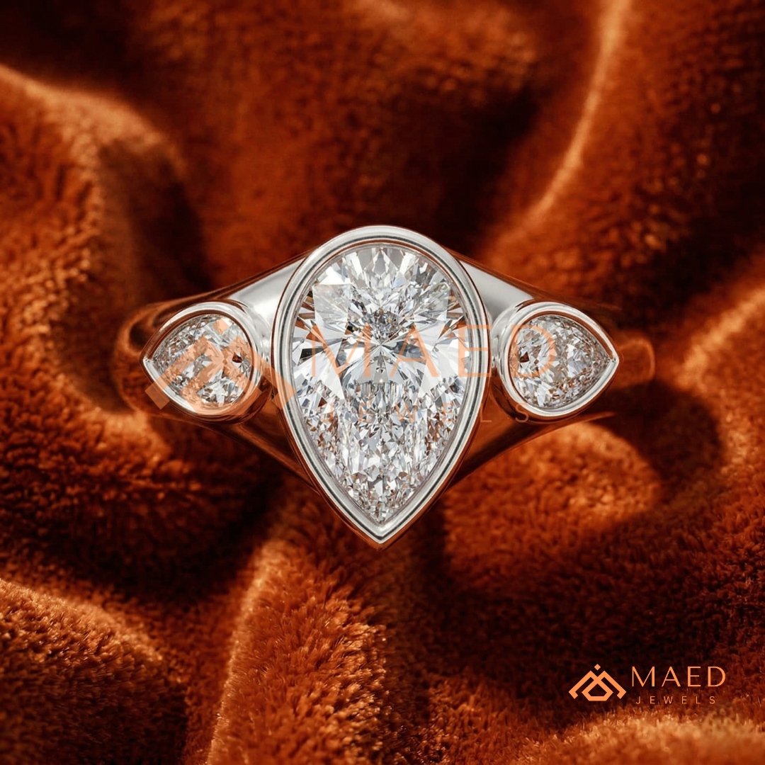 Modern Three-Stone Pear Shaped Bezel Engagement Ring in Silver, 14K Gold & Rose Gold