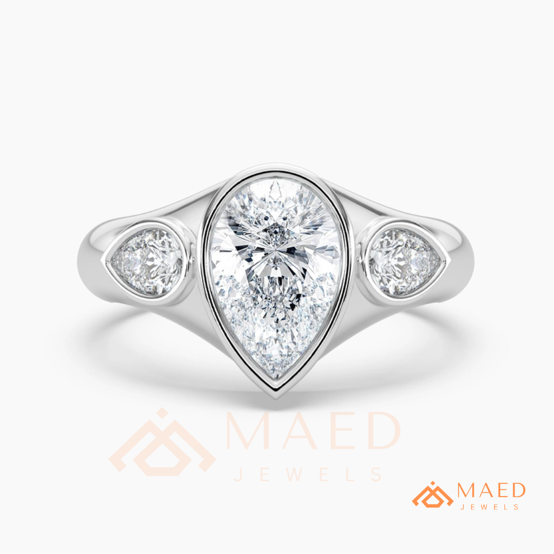 Modern Three-Stone Pear Shaped Bezel Engagement Ring in Silver, 14K Gold & Rose Gold
