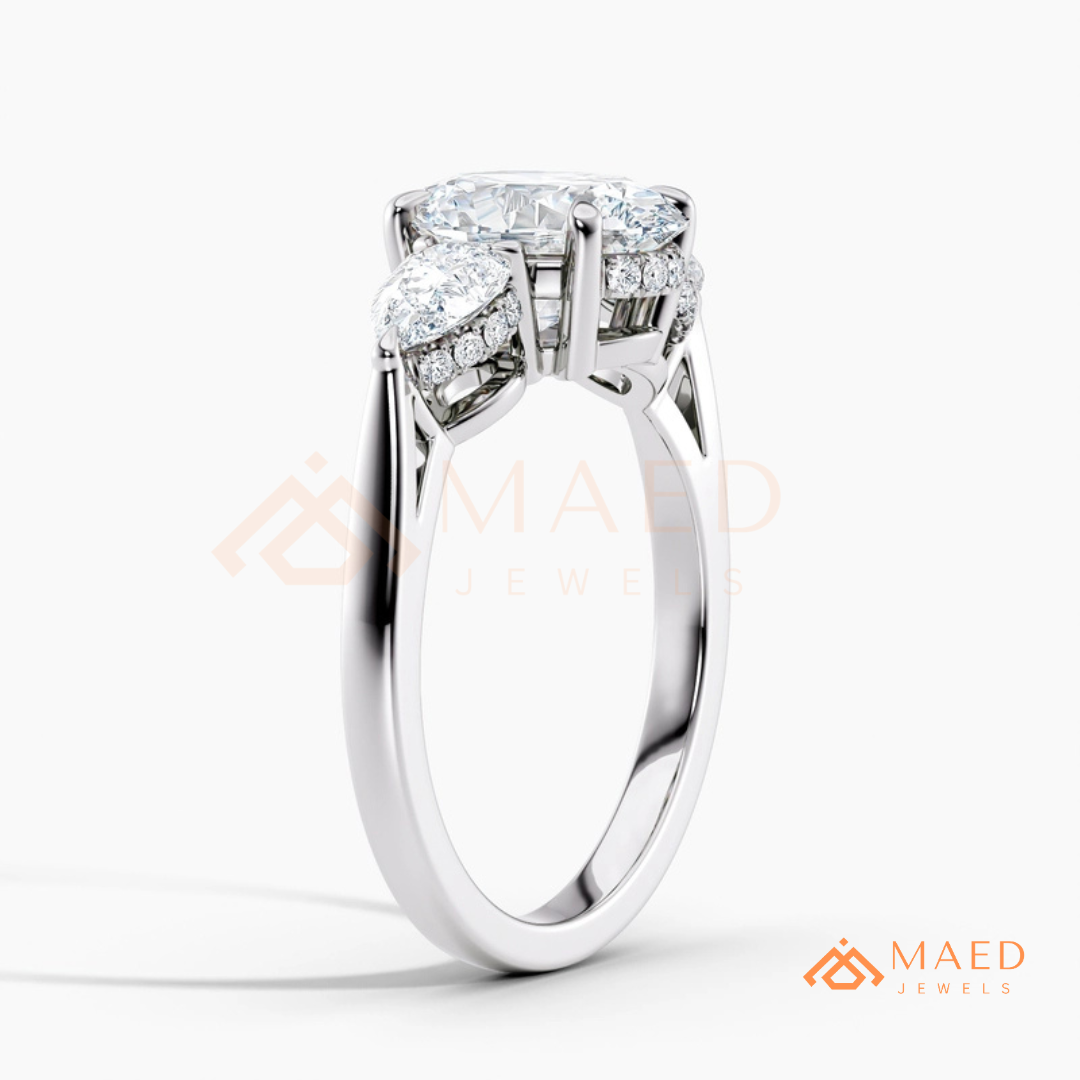 Classic Oval Cut Three-Stone Engagement Ring with Pear Side Stones in Silver, 14K Gold & Rose Gold