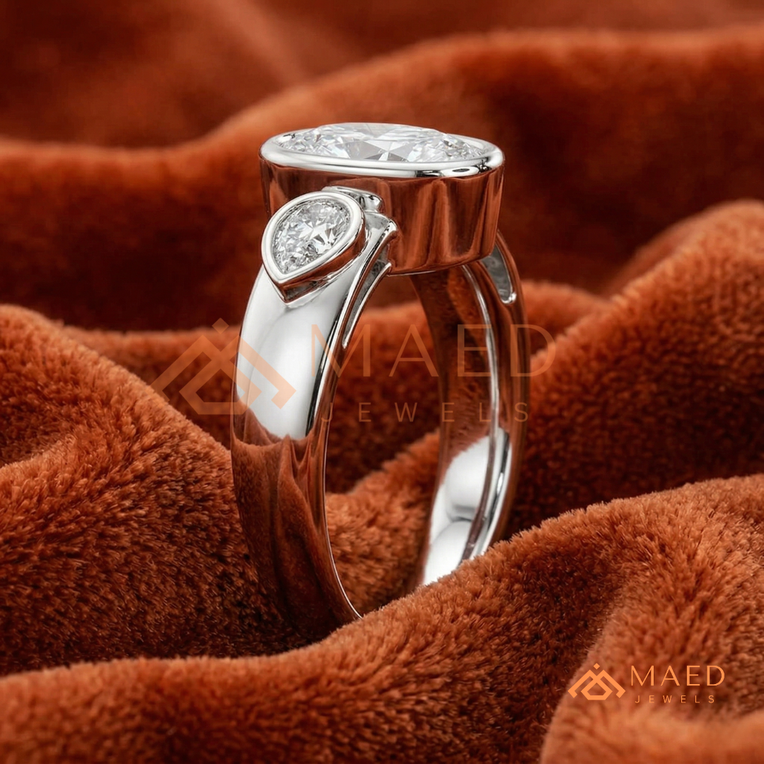 Bezel Set Oval Engagement Ring with Pear Side Stones in Silver, 14K Gold, & 14K Rose Gold