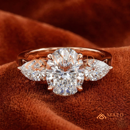 Classic Oval Cut Three-Stone Engagement Ring with Pear Side Stones in Silver, 14K Gold & Rose Gold