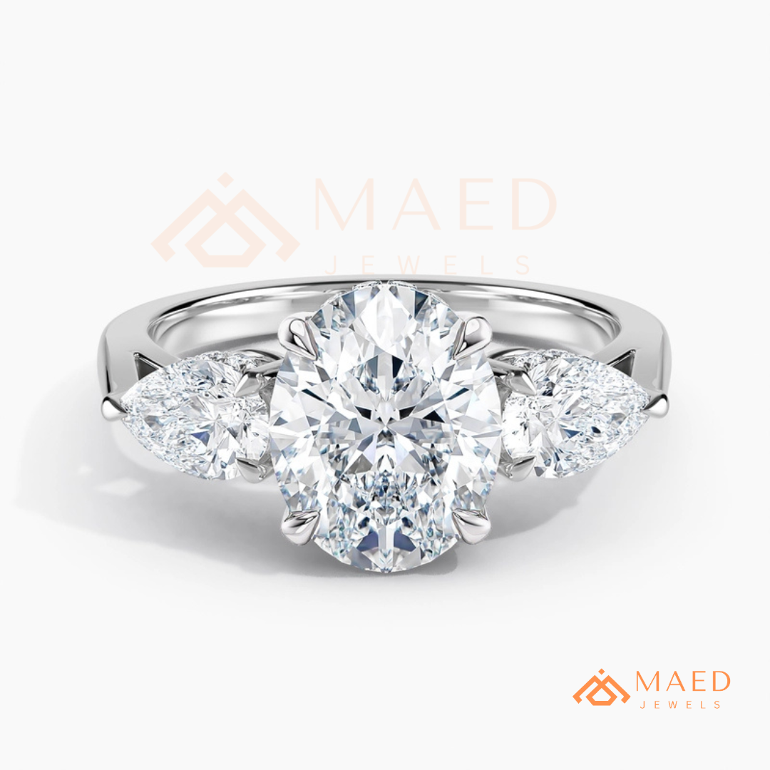 Classic Oval Cut Three-Stone Engagement Ring with Pear Side Stones in Silver, 14K Gold & Rose Gold