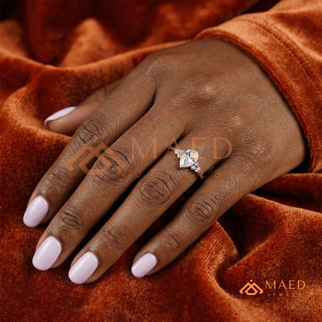 Pear Cut Bezel Set Engagement Ring with Cluster Accent Diamonds in 14K Gold, Rose Gold & Silver