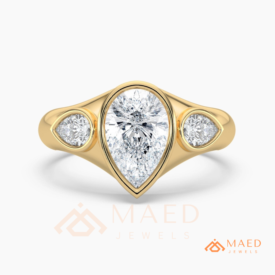 Modern Three-Stone Pear Shaped Bezel Engagement Ring in Silver, 14K Gold & Rose Gold