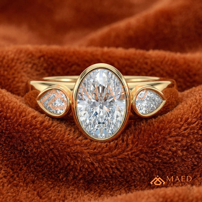 Bezel Set Oval Engagement Ring with Pear Side Stones in Silver, 14K Gold, & 14K Rose Gold