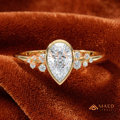 Pear Cut Bezel Set Engagement Ring with Cluster Accent Diamonds in 14K Gold, Rose Gold & Silver