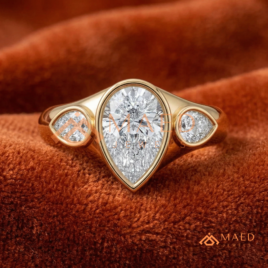 Modern Three-Stone Pear Shaped Bezel Engagement Ring in Silver, 14K Gold & Rose Gold