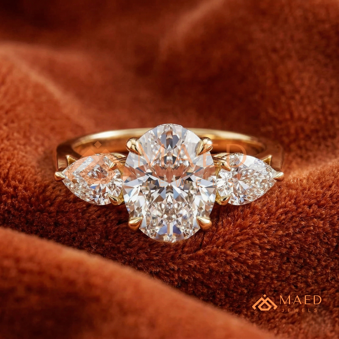 Classic Oval Cut Three-Stone Engagement Ring with Pear Side Stones in Silver, 14K Gold & Rose Gold