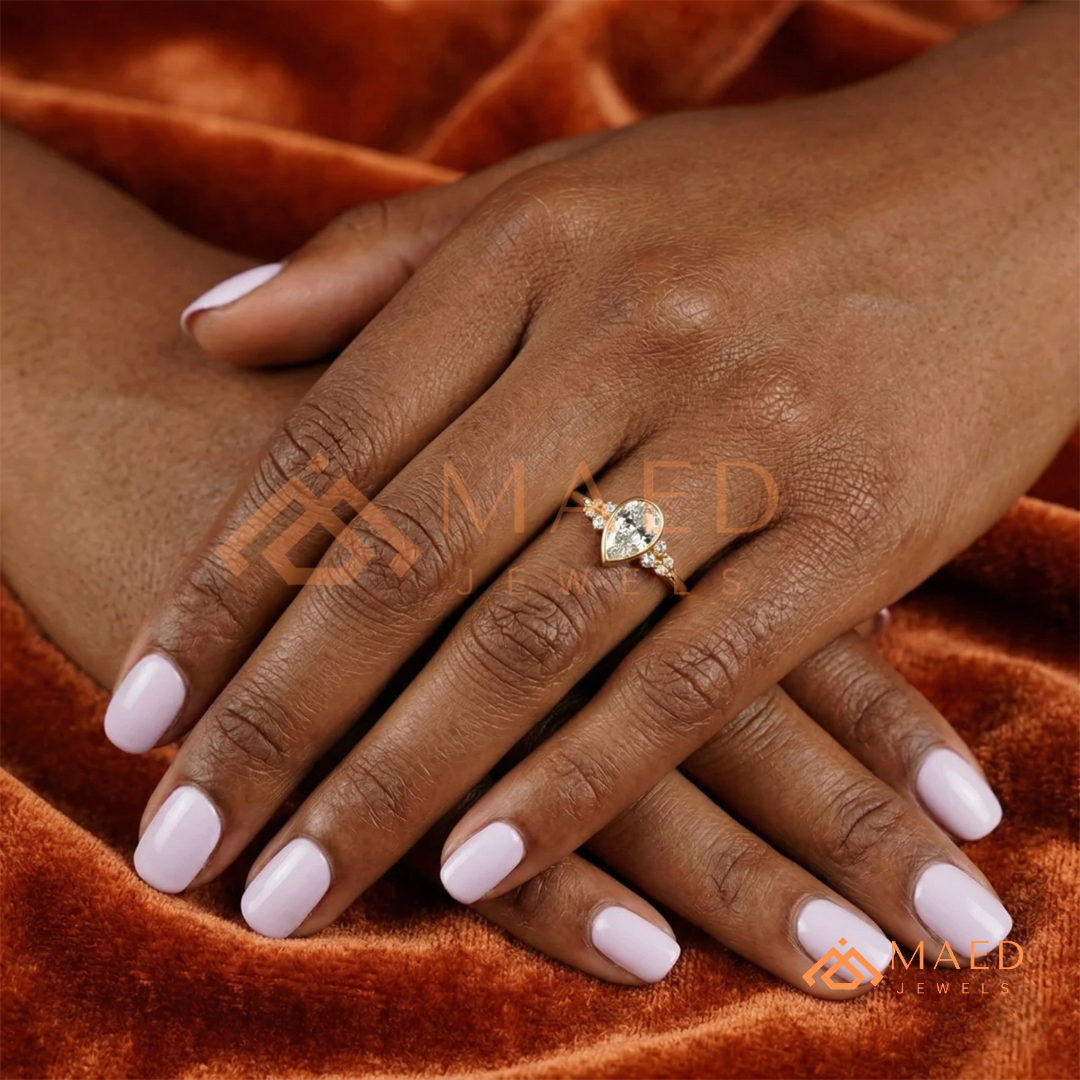 Pear Cut Bezel Set Engagement Ring with Cluster Accent Diamonds in 14K Gold, Rose Gold & Silver