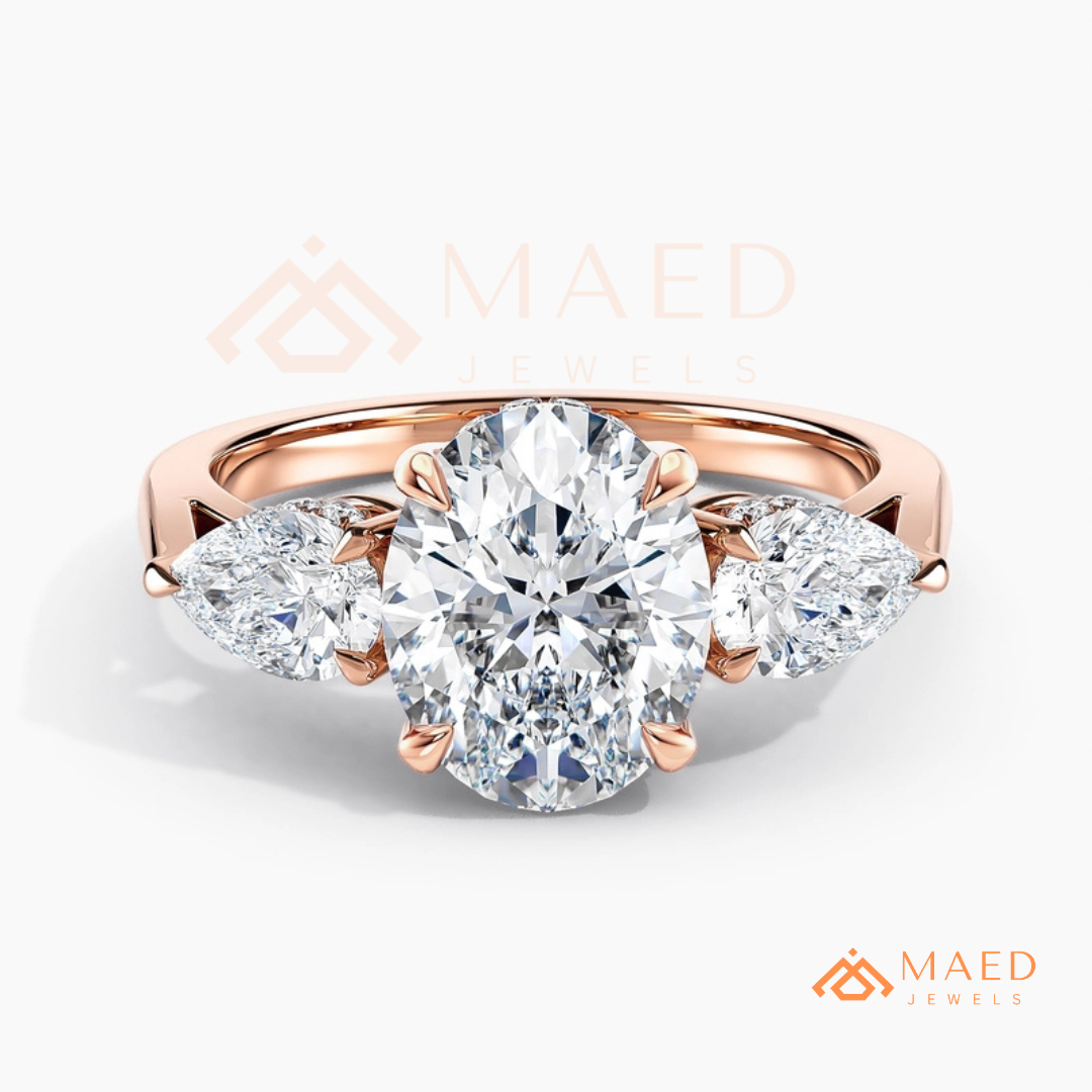 Classic Oval Cut Three-Stone Engagement Ring with Pear Side Stones in Silver, 14K Gold & Rose Gold