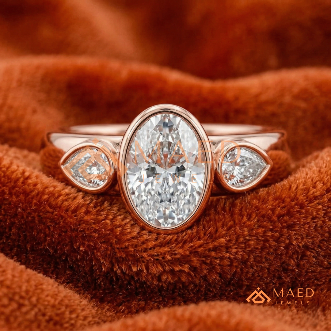 Bezel Set Oval Engagement Ring with Pear Side Stones in Silver, 14K Gold, & 14K Rose Gold
