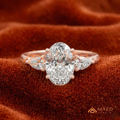 Oval Cut Engagement Ring with Pear Side Stones in Silver, 14K Gold, & 14K Rose Gold