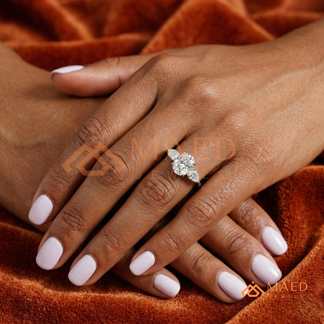 Classic Oval Cut Three-Stone Engagement Ring with Pear Side Stones in Silver, 14K Gold & Rose Gold