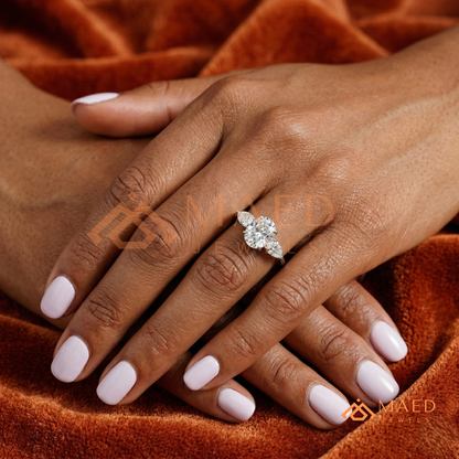 Classic Oval Cut Three-Stone Engagement Ring with Pear Side Stones in Silver, 14K Gold & Rose Gold