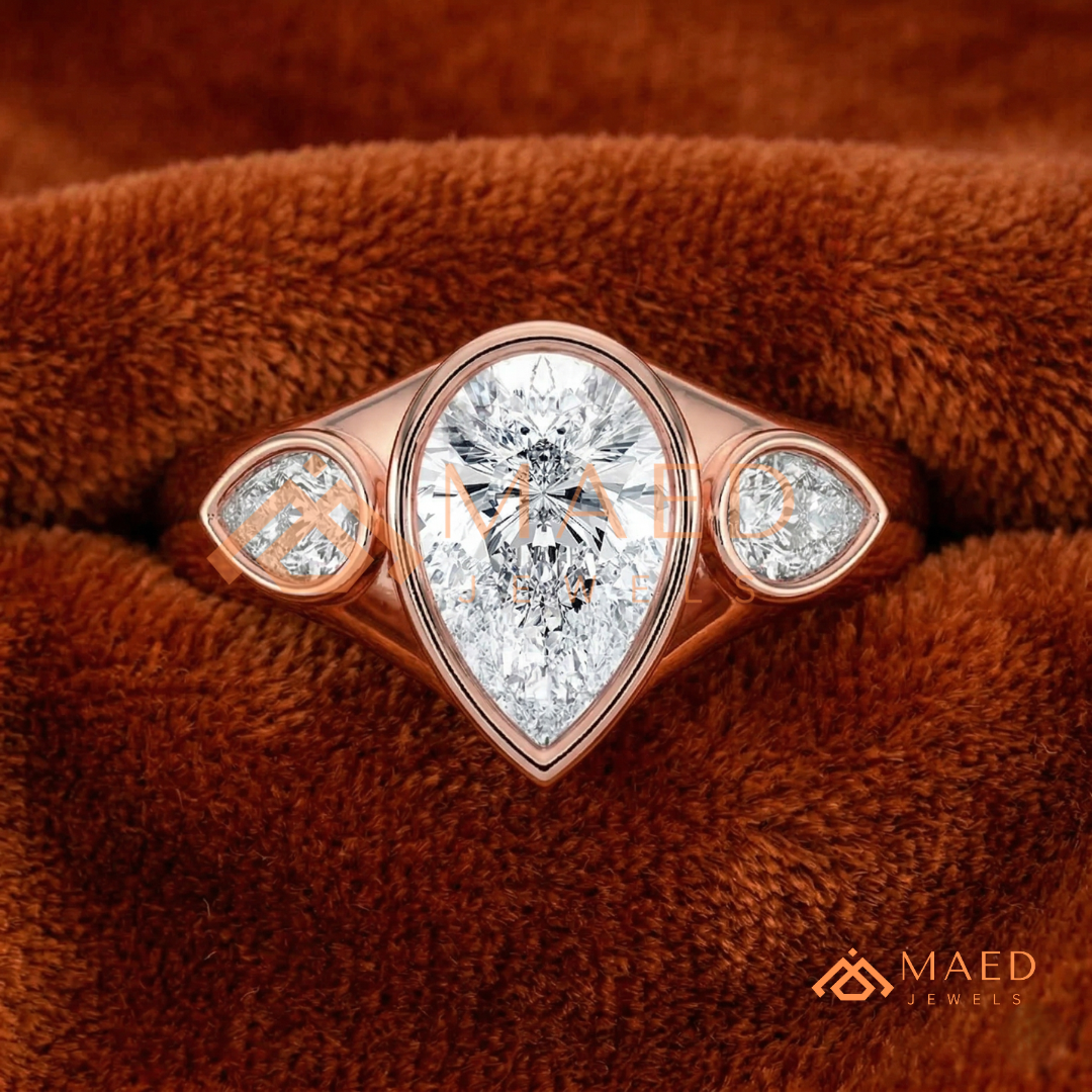 Modern Three-Stone Pear Shaped Bezel Engagement Ring in Silver, 14K Gold & Rose Gold